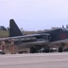 Máy bay chiến đấu Su-25 của Không quân Nga đậu trên đường băng tại căn cứ không quân Heymim ngày 5/10. (Ảnh: Reuters/TTXVN)