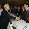 Tổng Bí thư Nguyễn Phú Trọng với các đại biểu doanh nhân. (Ảnh: Trí Dũng/TTXVN)