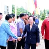  Lãnh đạo tỉnh Vientiane đón Phó Chủ tịch nước Nguyễn Thị Doan. (Ảnh: Thống Nhất/TTXVN)
