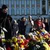 Tưởng niệm các nạn nhân vụ rơi máy bay ở bán đảo Sinai, Ai Cập, tại quảng trường St. Petersburg ngày 3/11 vừa qua. (Ảnh: AFP/TTXVN)