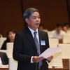 Bộ trưởng Bộ Tài Nguyên và Môi trường Nguyễn Minh Quang trả lời chất vấn. (Ảnh: Phương Hoa/TTXVN)