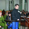 Bị cáo Phạm Thanh Tân, nguyên Tổng giám đốc Agribank đứng trước vành móng ngựa. (Ảnh: Doãn Tấn/TTXVN)