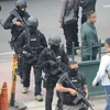 Cảnh sát Indonesia làm nhiệm vụ tại hiện trường vụ tấn công ngày 14/1 vừa qua. (Ảnh: AFP/TTXVN)