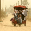 Trẻ em Palestine đi xe kéo ở Khan Yunis ở miền nam Gaza trong một cơn bão cát xảy ra ở Trung Đông vào ngày 9/9/2015. (Nguồn: upi.com)