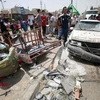 Hiện trường vụ đánh bom ở Sadr City, Baghdad, Iraq ngày 11/5. (Ảnh: AFP/TTXVN)
