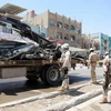 Lực lượng an ninh Iraq đứng canh gác sau một vụ đánh bom tại phía Bắc Baghdad, Iraq ngày 30/5 vừa qua. (Nguồn: Reuters)
