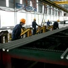 Sản xuất thép cây tại Công ty cổ phần Sản xuất Thép Việt Đức thuộc Tập đoàn Thép Việt Đức. (Ảnh: Huy Hùng/TTXVN)