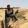  Lực lượng an ninh Afghanistan tham gia chiến dịch truy quét Taliban ở tỉnh Kunduz ngày 19/7 vừa qua. (Ảnh: THX/TTXVN)