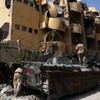 Lực lượng GNA trong một chiến dịch quân sự chống IS tại thành phố Sirte. (Ảnh: THX/TTXVN)