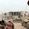 Xe tăng của lực lượng ủng hộ Chính phủ Libya tham gia chiến dịch giải phóng Sirte ngày 21/11 vừa qua. (Ảnh: THX/TTXVN)