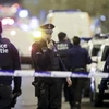 Cảnh sát Bỉ trong chiến dịch truy quét khủng bố tại quận Schaerbeek, thủ đô Brussels ngày 19/12. (Ảnh: EPA/TTXVN)