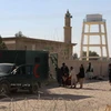 Cảnh sát điều tra tại hiện trường vụ đánh bom ở Lashkar Gah, tỉnh Helmand ngày 10/1. (Ảnh: EPA/TTXVN)