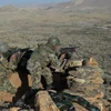 Lực lượng an ninh Afghanistan trong chiến dịch truy quét phiến quân Taliban tại tỉnh Nangarhar. (Ảnh: AFP/TTXVN)
