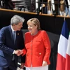 Thủ tướng Italy Paolo Gentiloni (trái) và Thủ tướng Đức Angela Merkel (phải) tham dự Hội nghị. (Ảnh: AFP/TTXVN)