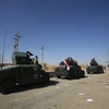 Lực lượng Chính phủ Iraq tiến vào giếng dầu Bai Hassan ở phía tây thành phố Kirkuk ngày 17/10 vừa qua. (Ảnh: AFP/TTXVN)