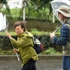 Mưa to gió lớn khi bão Lan đổ bộ vào Tokyo, Nhật Bản ngày 22/10. (Ảnh: AFP/TTXVN)