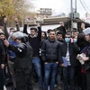 Người dân tham gia biểu tình tại Sulaymaniyah, Khu tự trị người Kurd, miền bắc Iraq ngày 19/12. (Ảnh: AFP/TTXVN)