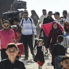 Hàng chục nghìn người tị nạn Syria tại Thổ Nhĩ Kỳ đang tạm thời trở về quê nhà để tham gia dịp lễ Eid al-Adha ngày 27/8 vừa qua. (Ảnh: AFP/TTXVN)