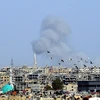 Khói bốc lên sau một cuộc không kích tại Đông Ghouta, Syria ngày 2/3 vừa qua.(Ảnh: THX/TTXVN)