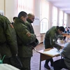 Cử tri Nga bỏ phiếu tại một điểm bầu cử ở thủ đô Moskva ngày 18/3. (Ảnh: AFP/TTXVN)