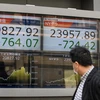 Chỉ số Nikkei tại sàn giao dịch chứng khoán Tokyo của Nhật Bản ngày 23/3 vừa qua. (Ảnh: AFP/TTXVN)