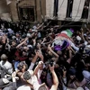 Đám tang của nữ nhân viên y tế Razan al-Najjar. (Nguồn: AFP)