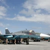 Nhân viên kỹ thuật bảo trì máy bay Su-34 của Nga. (Ảnh: EPA/TTXVN)