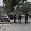 Lực lượng an ninh Afghanistan điều tra tại hiện trường vụ tấn công ở Jalalabad, Nangarhar ngày 11/6. (Ảnh: THX/TTXVN)