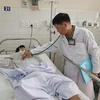 Anh Lê Xuân T., 33 tuổi, ngụ huyện Hóc Môn, điều trị tại bệnh viện Thống Nhất thành phố Hồ Chí Minh. (Ảnh: Đinh Hằng/TTXVN)
