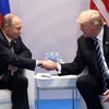 Tổng thống Mỹ Donald Trump và Tổng thống Nga Vladimir Putin. (Ảnh: AFP/TTXVN)