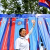 Ủng hộ Thủ tướng Campuchia Hun Sen và Đảng Nhân dân Campuchia tại một cuộc mít tinh ở thủ đô Phnom Penh. (Ảnh: AFP/TTXVN)