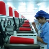Dây chuyền sản xuất sợi tại Công ty TNHH Dệt nhuộm Jasan Việt Nam vốn đầu tư của Trung Quốc tại khu công nghiệp Phố nối B, huyện Mỹ Hào, tỉnh Hưng Yên. (Ảnh: Phạm Kiên/TTXVN)