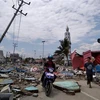 Đường phố, nhà cửa bị tàn phá sau động đất và sóng thần ở Palu, đảo Sulawesi của Indonesia ngày 29/8. (Ảnh: AFP/TTXVN)