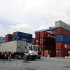 Các container phế liệu nằm rải rác trong cảng Cát Lái. (Ảnh:Hoàng Hải/TTXVN)