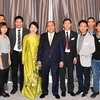 Thủ tướng Nguyễn Xuân Phúc, Phu nhân gặp gỡ cán bộ nhân viên Đại sứ quán và đại diện cộng đồng Việt Nam tại Đan Mạch. (Ảnh: Thống Nhất/TTXVN) 