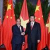Thủ tướng Nguyễn Xuân Phúc hội kiến Tổng Bí thư, Chủ tịch Trung Quốc Tập Cận Bình. (Ảnh: Thống Nhất/TTXVN)