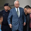 Cựu Thủ tướng Malaysia Najib Razak - ở giữa. (Ảnh: AFP/TTXVN)