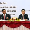 Phó Thủ tướng, Bộ trưởng Bộ Ngoại giao Phạm Bình Minh (phải) và Phó Thủ tướng, Bộ trưởng Bộ Nội vụ Vương quốc Campuchia Sar Kheng (trái) đồng chủ trì Hội nghị. (Ảnh: Xuân Khu/TTXVN)