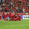 Niềm vui chiến thắng của các cầu thủ Việt Nam trong trận đấu gặp tuyển Jordan vòng 1/8 AFC Asian Cup 2019 tại Dubaicủa UAE ngày 20/1. (Ảnh: AFP/TTXVN)