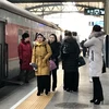 Đoàn nghệ thuật Triều Tiên tới thủ đô Bắc Kinh của Trung Quốc ngày 24/1 vừa qua. (Ảnh: Yonhap/TTXVN)