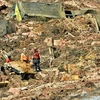 Lực lượng cứu hộ tìm kiếm người mất tích tại hiện trường vụ vỡ đập hồ chứa chất thải khoáng sản ở Minas Gerais, Brazil, ngày 25/1/ vừa qua. (Ảnh: THX/TTXVN)