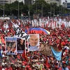 gười dân Venezuela tuần hành tại thủ đô Caracas, bày tỏ sự ủng hộ Tổng thống Nicolas Maduro. (Nguồn: AFP/TTXVN)