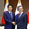 Thủ tướng Nhật Bản Shinzo Abe và Tổng thống Hàn Quốc Moon Jae-in bên lề Đại hội đồng Liên hợp quốc hồi tháng 9/2018. (Nguồn: Kyodo)