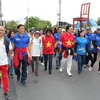 Các đại biểu Bộ Y tế Việt Nam và Phái đoàn thường trực Việt Nam tại Geneva tham dự sự kiện thể thao cộng đồng do WHO tổ chức. (Ảnh: Hoàng Hoa/TTXVN)