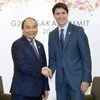 Thủ tướng Nguyễn Xuân Phúc gặp Thủ tướng Canada Justin Trudeau. (Ảnh: Thống Nhất/TTXVN)