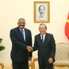Phó Thủ tướng Thường trực Trương Hòa Bình và Chánh án Tòa án nhân dân tối cao Cuba Rubén Remigio Ferro. (Ảnh: Doãn Tấn/TTXVN)