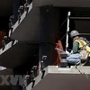 Công nhân làm việc tại một công trường xây dựng ở San Francisco, California, Mỹ. (Ảnh: AFP/TTXVN)