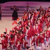 Đoàn thể thao Việt Nam diễu hành trong lễ khai mạc với 856 thành viên, tranh tài ở hơn 40 nội dung. (Ảnh: Hoàng Linh/TTXVN)
