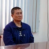 Đối tượng người Đài Loan trốn nã bị Bộ Công an Việt Nam bắt giữ. (Ảnh: Thành Chung/TTXVN)
