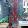 Cần cẩu tháp cao 30m sập tại một công trường xây dựng ở Incheon ngày 3/1. (Nguồn: Yonhap)